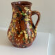 Studio ceramic pitcher with sprayed glazes – circa 1960-70