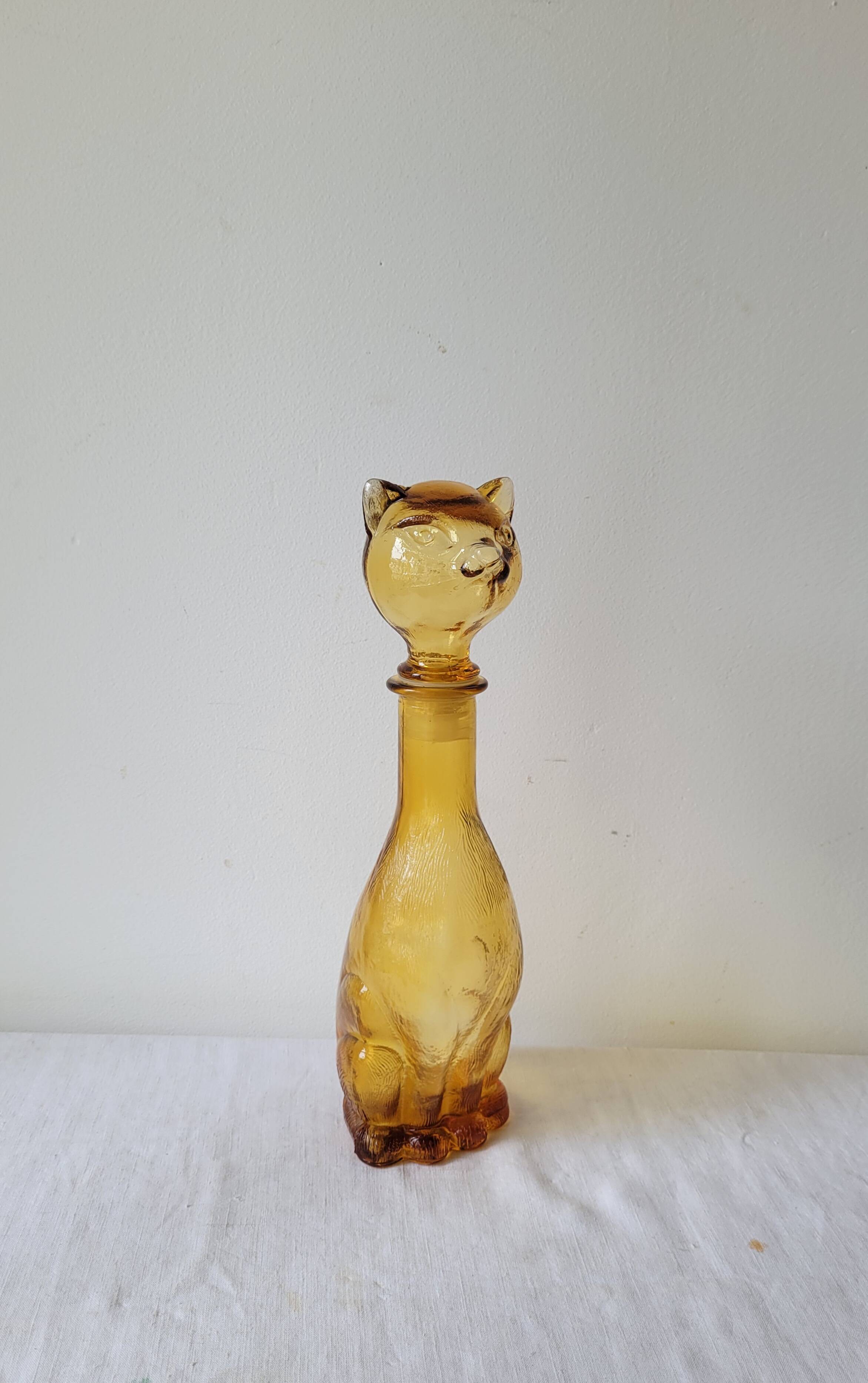 Zoomorphic carafe in amber glass