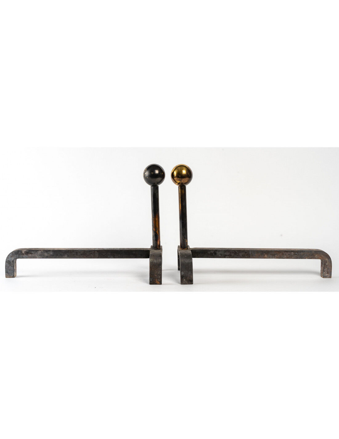 Pair of cast iron and brass chenets, 1960