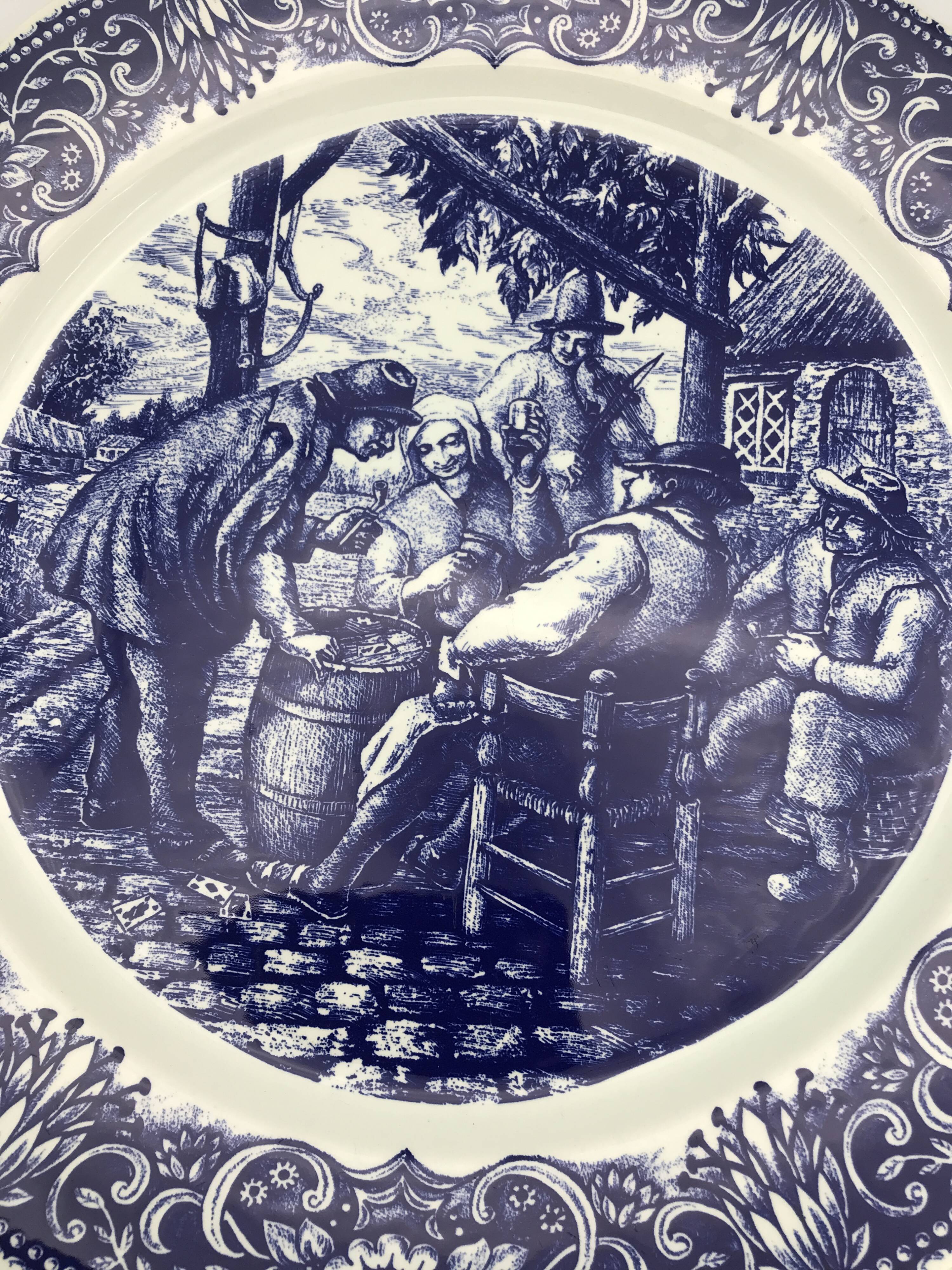 Blue enamelled earthenware wall dish with peasant scene decor Boch La Louvière