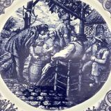 Blue enamelled earthenware wall dish with peasant scene decor Boch La Louvière