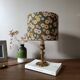 brass table lamp | khaki lampshade with multicoloured daisies