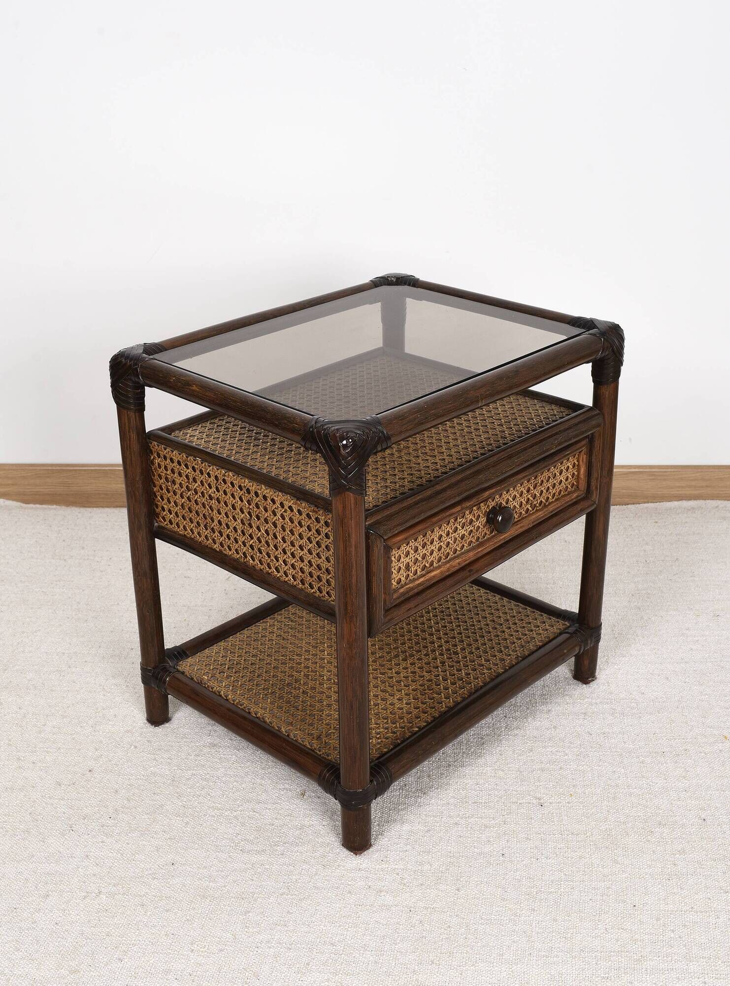 Rattan and cane bedside table, smoked glass top