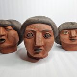 Set of 3 decorative women's heads in red terracotta