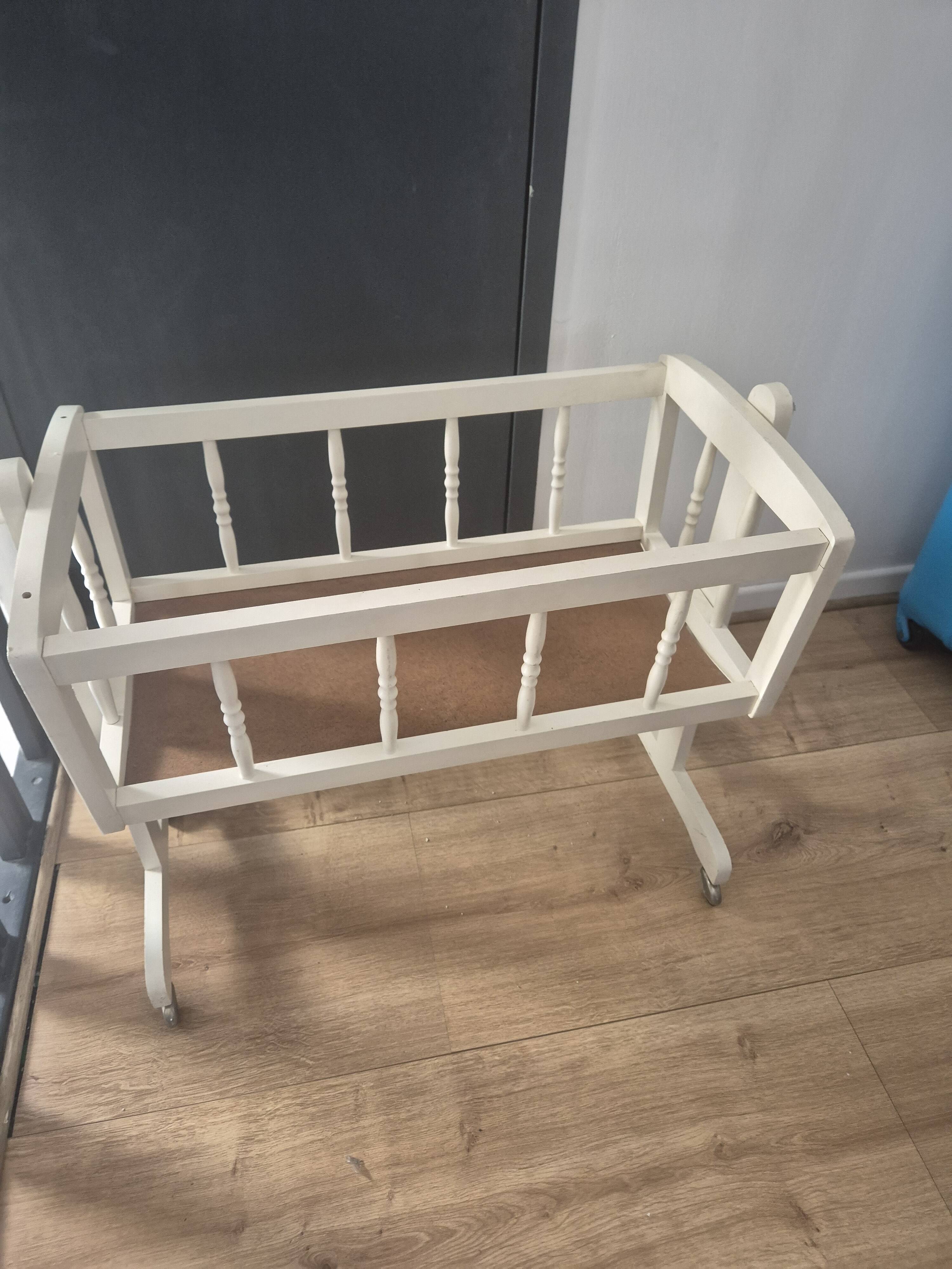 white wooden rocking cradle for baby or doll