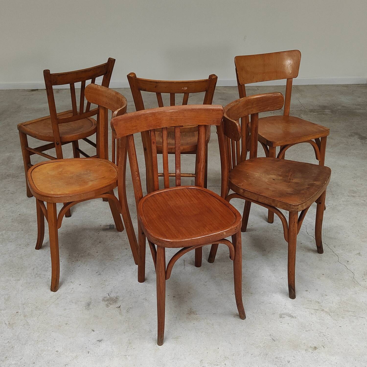 Set of 6 mismatched blond wood bistro chairs