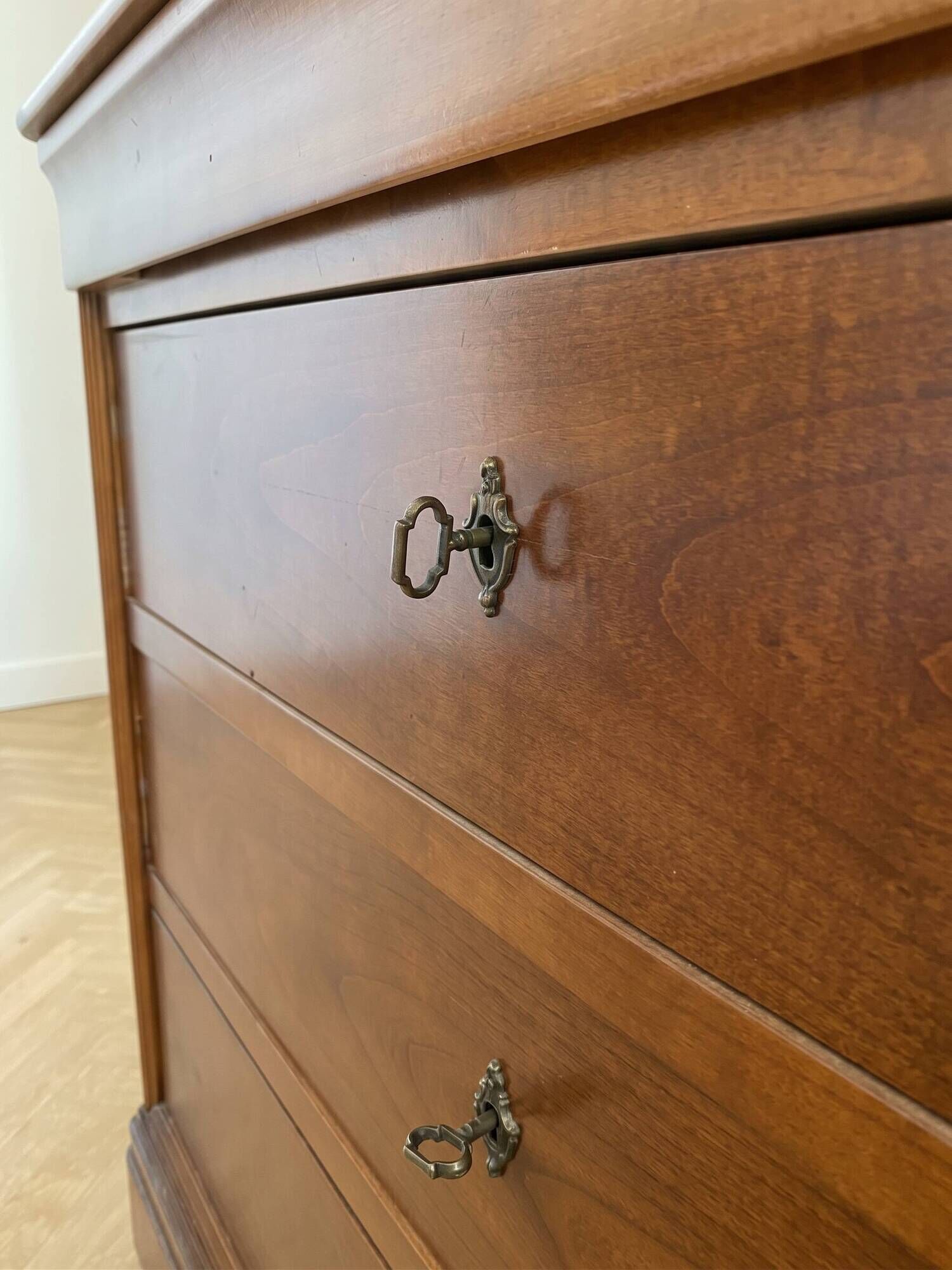 Antique solid wood chest of drawers with a secret drawer.
