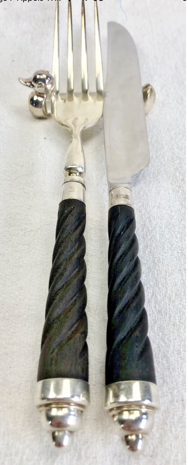 12 silver-plated metal duck knife rests with crystal.