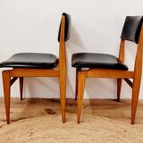 Six vintage wooden chairs and black Skaï