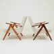 Pair of Mid-Century Modern armchairs in solid beech and boucle fabric.