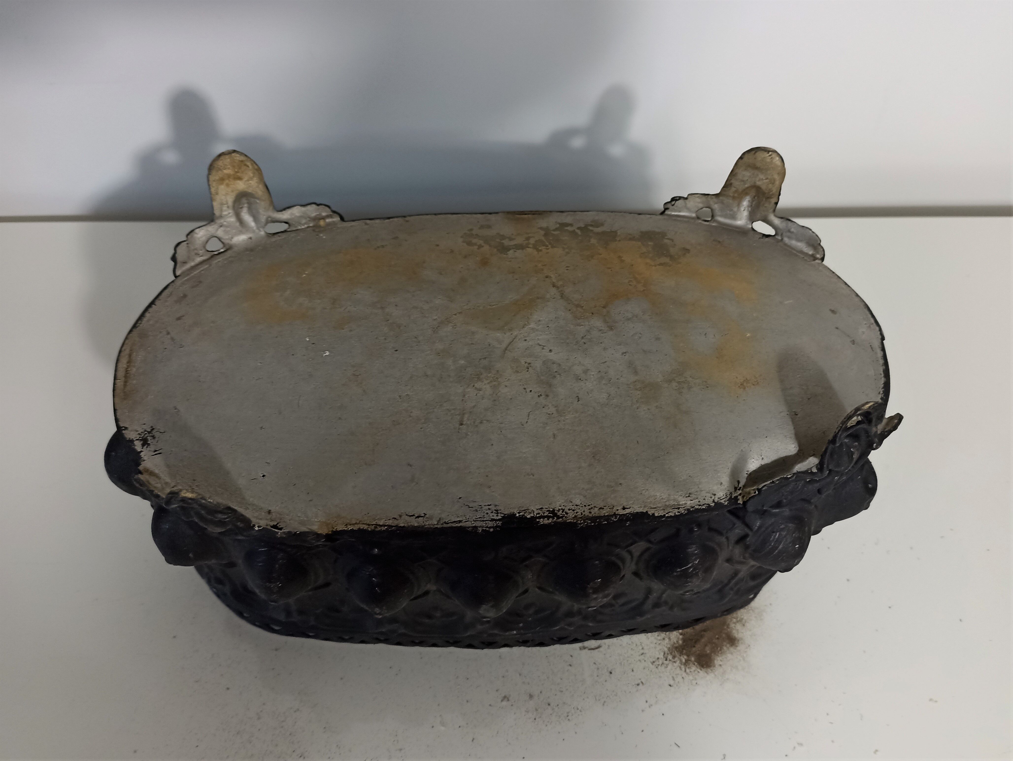 Old black iron planter
