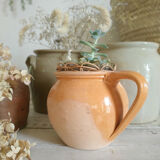 Old terracotta pot glazed ochre color