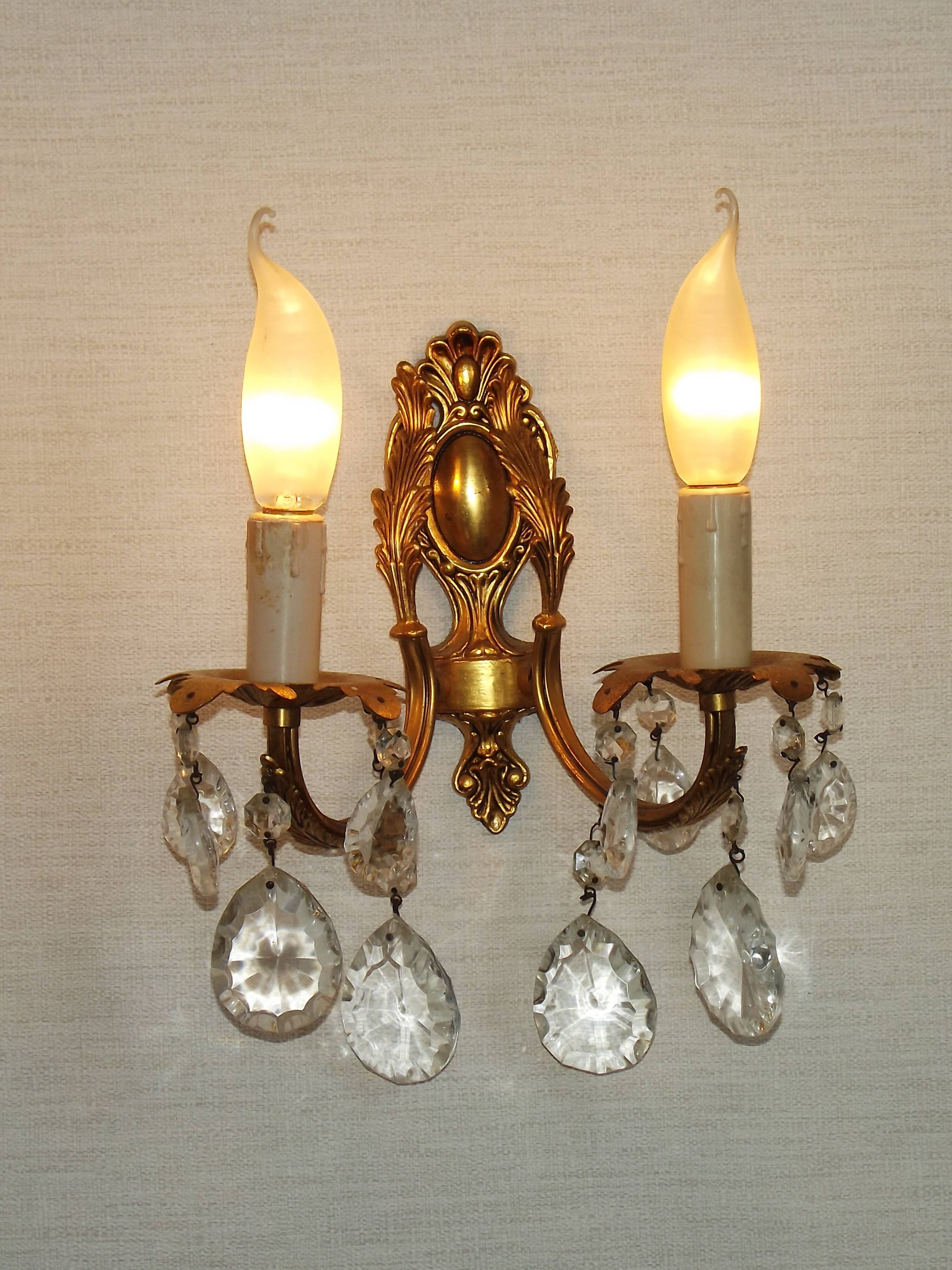 Pair of antique 2-light wall sconces in bronze with crystal pendants, Spain.