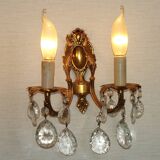 Pair of antique 2-light wall sconces in bronze with crystal pendants, Spain.