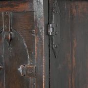 Unique antique English cabinet on stand made of oak from the 17th century