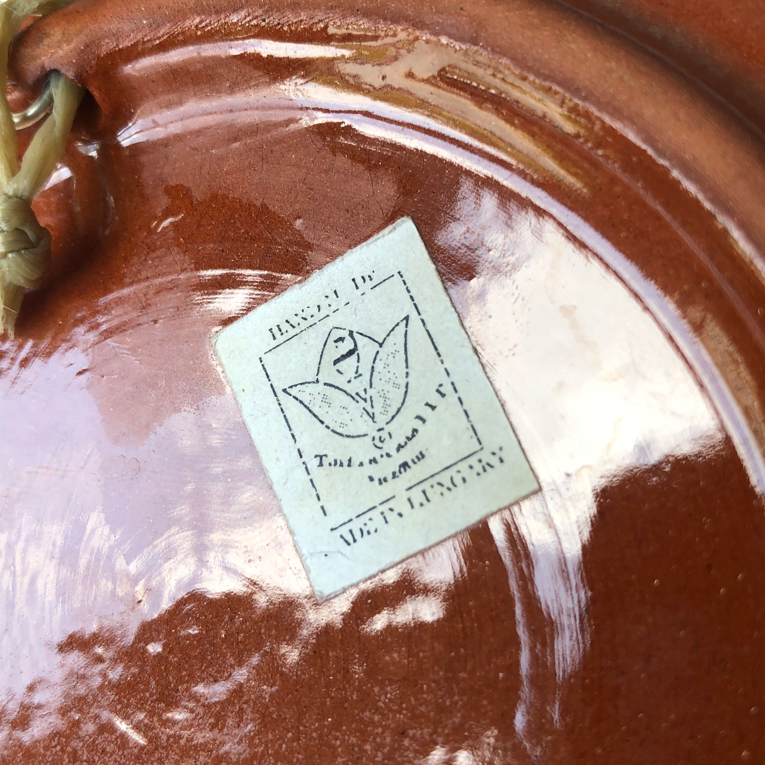 Very decorative serving plate in terracotta, floral and geometric motifs.