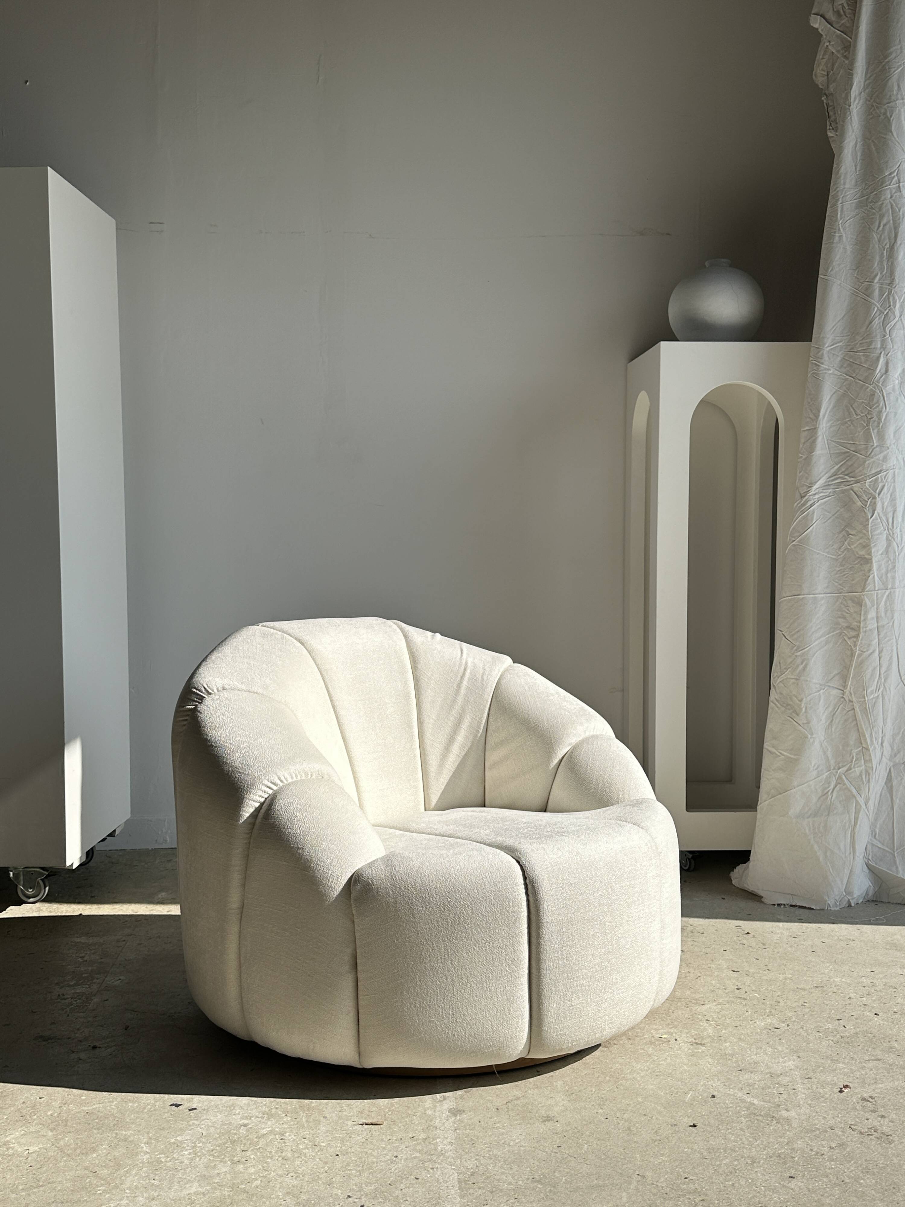 Large white circular armchair, white fabric upholstery
