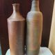 Duo of raw stoneware bottles