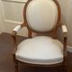 Pair of Louis XVI style medallion armchairs, late 19th / early 20th century.