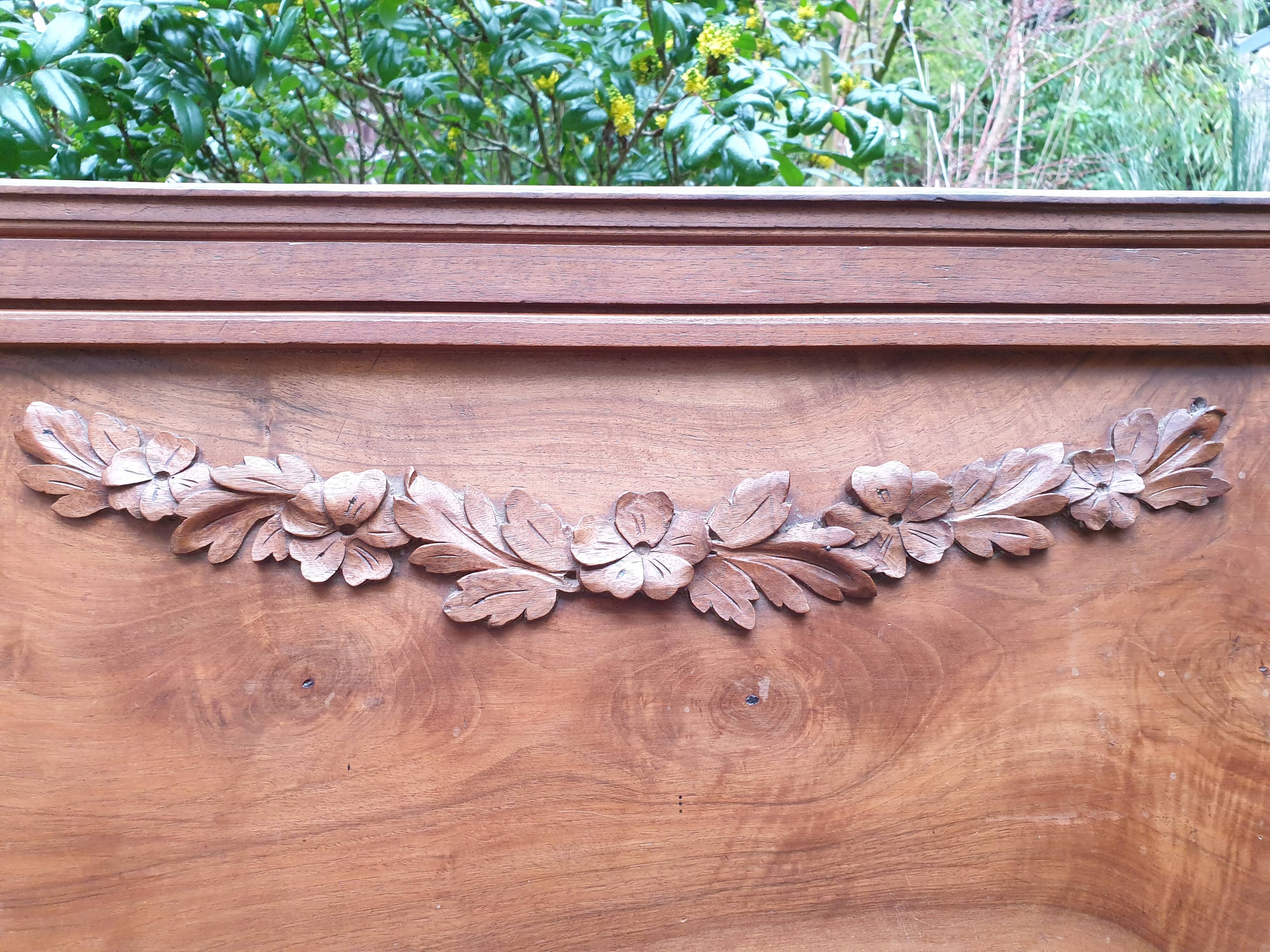 Carved walnut headboard