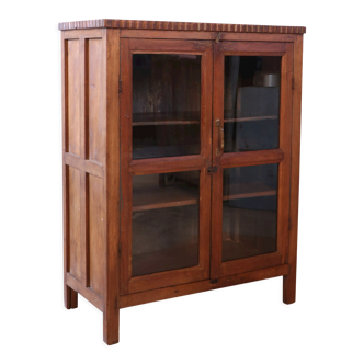 Former glazed cabinet in Burmese teak