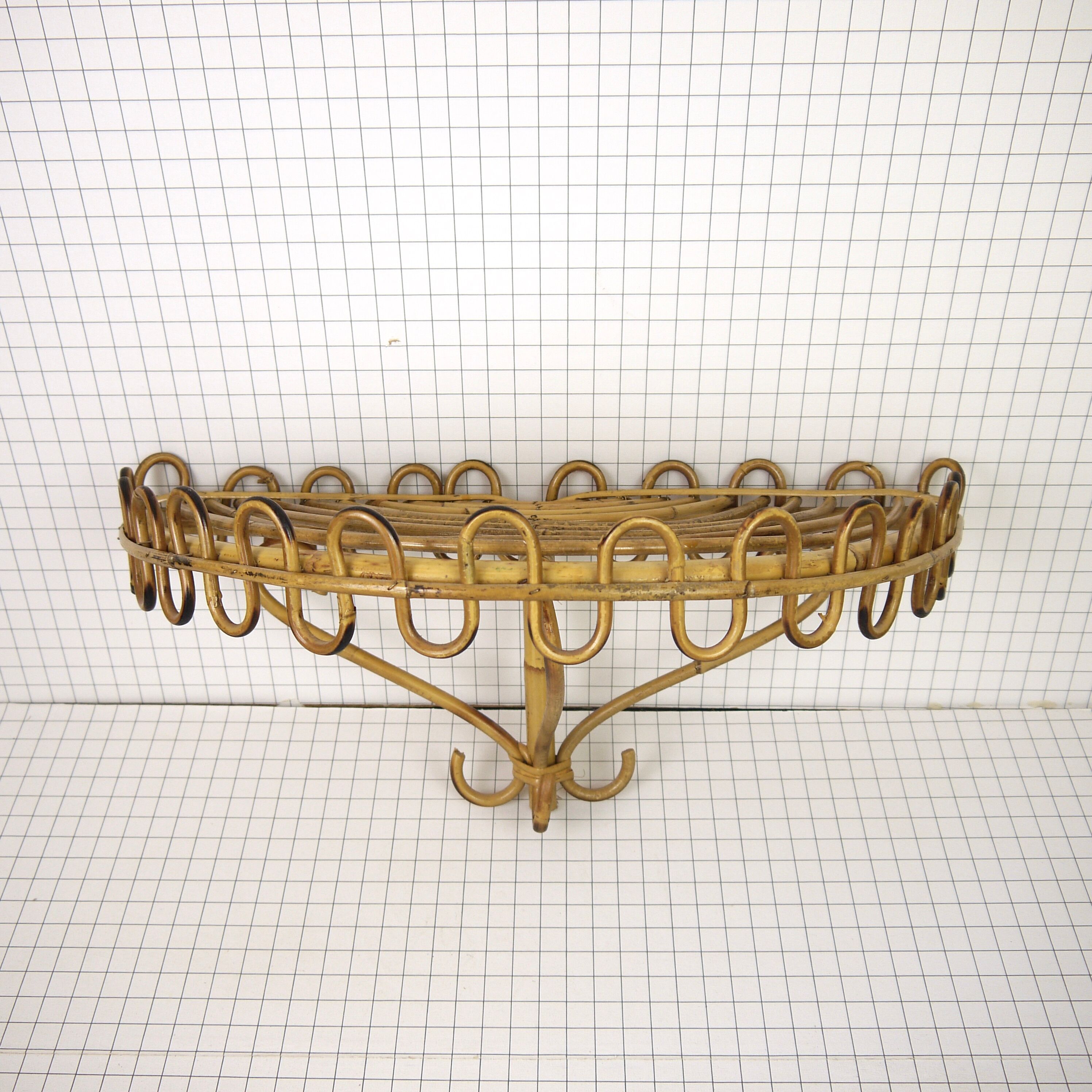 Half-moon rattan shelf and coat holder