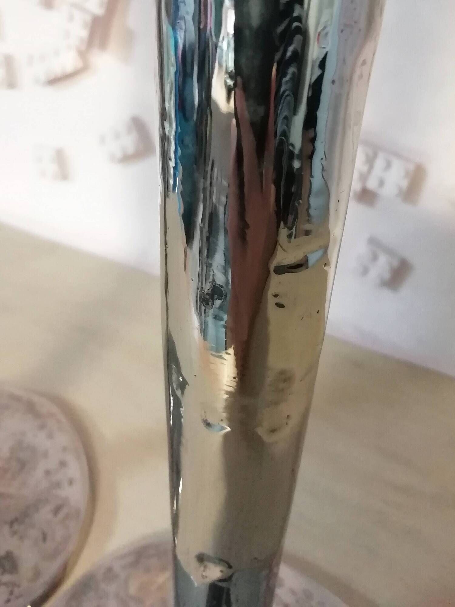 Pair of hammered metal candlesticks
