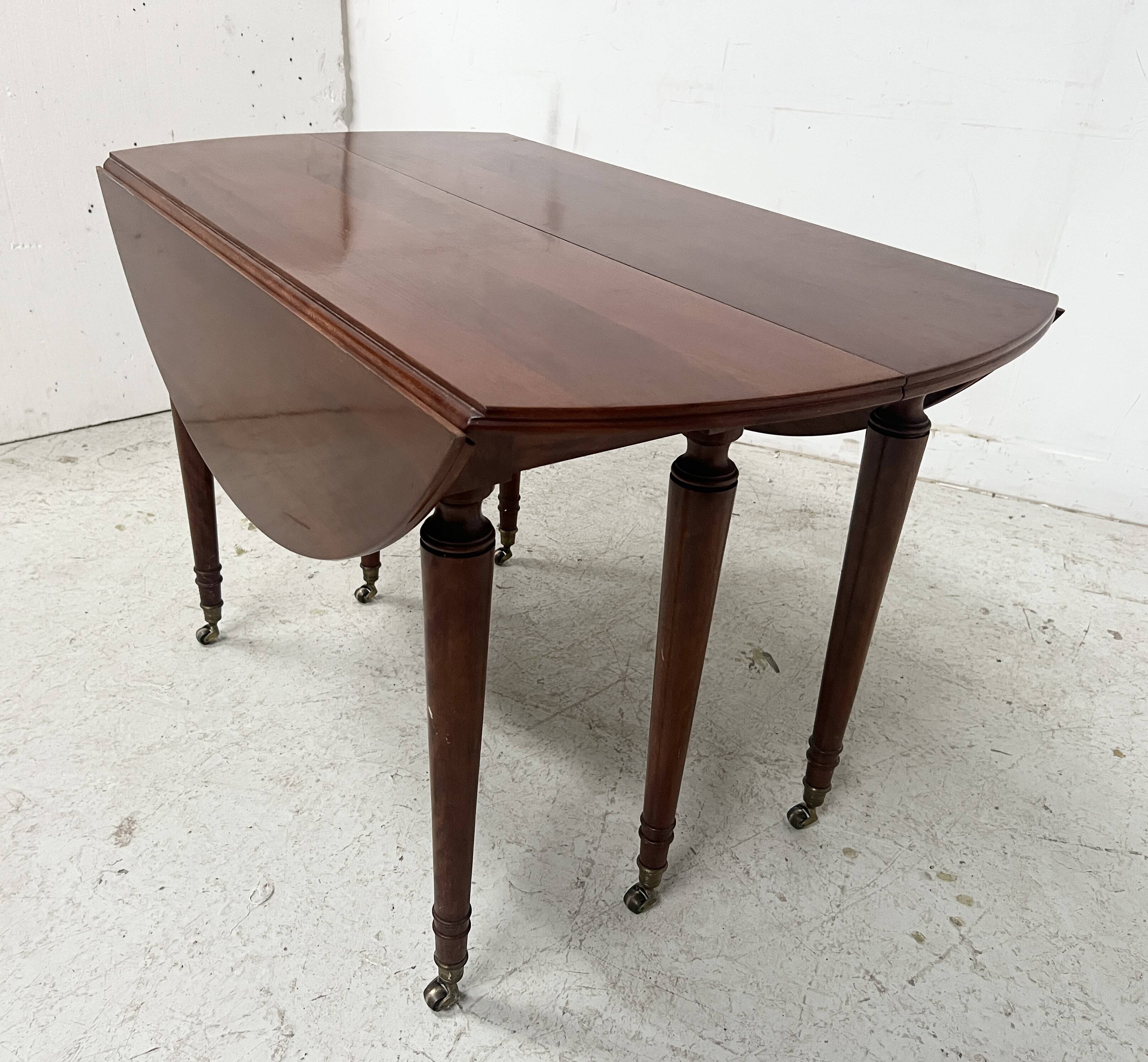 A six-foot Louis XVI style mahogany table from the 19th century.