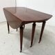 A six-foot Louis XVI style mahogany table from the 19th century.