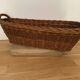 Vintage woven brown wicker baguette basket — long and elegant, 55×24×17 cm