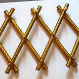 Wall coat rack in gilded metal