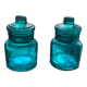 Two small turquoise blue glass jars