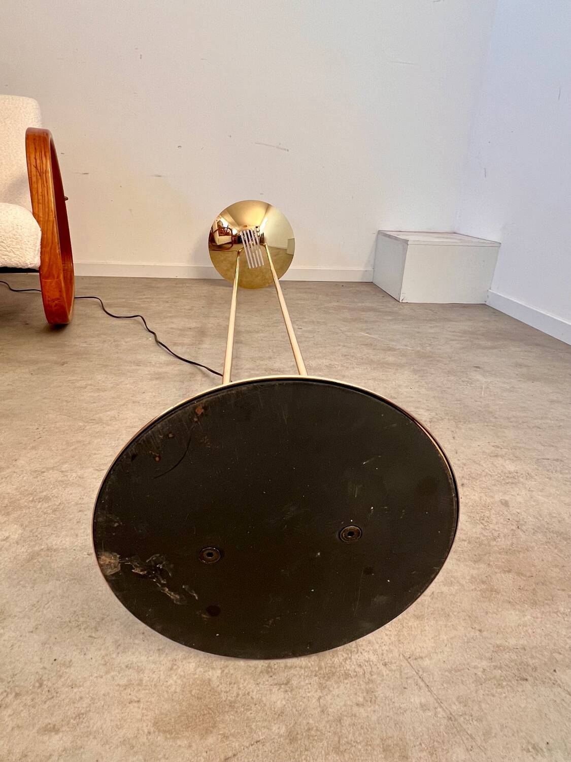 Old golden brass floor lamp with Italian design bulb from the 70s vintage