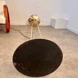 Old golden brass floor lamp with Italian design bulb from the 70s vintage