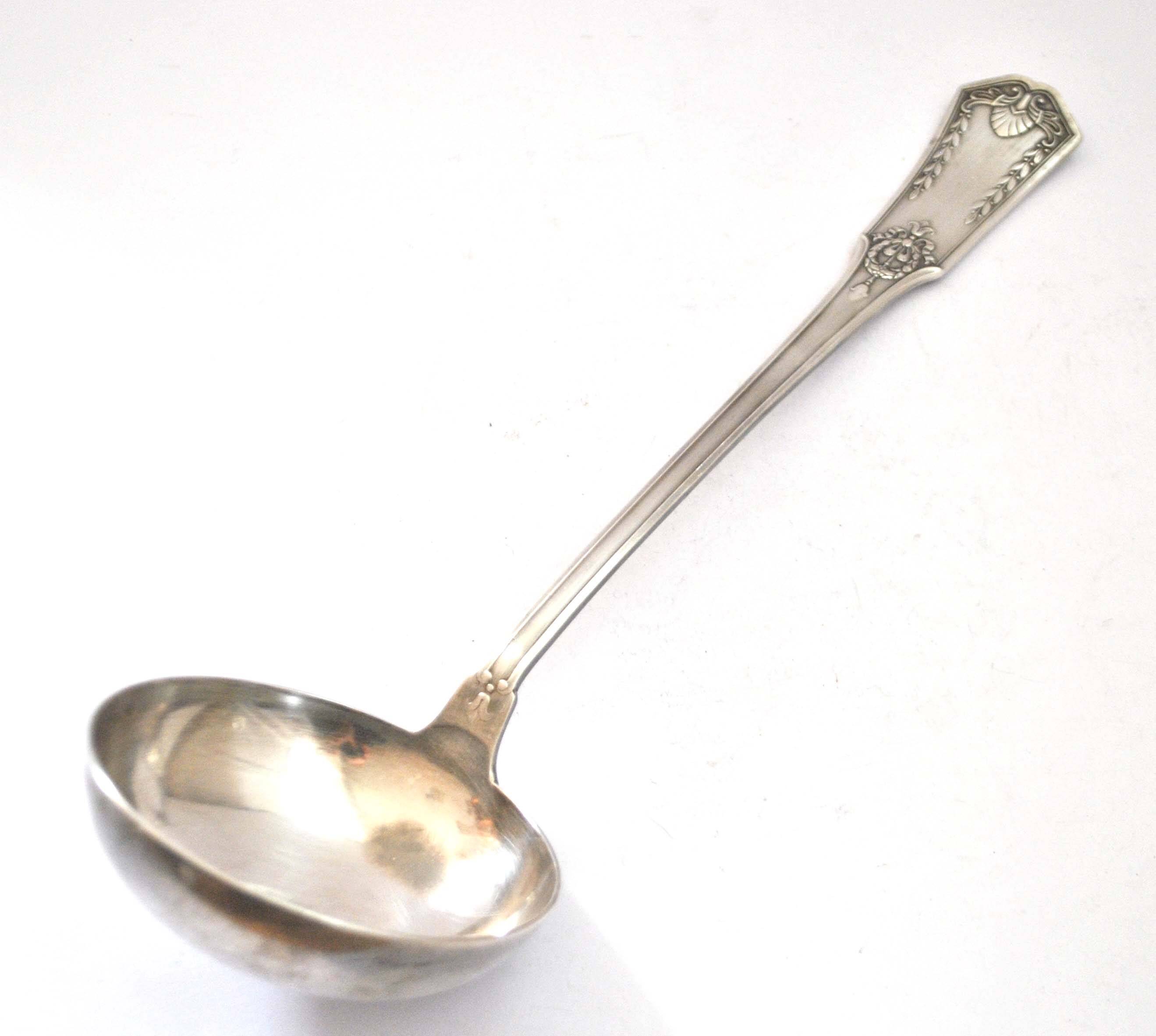 Empire ladle in silver metal SFAM - "Sans embarrass" model with winged shell laurel crown