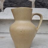 Beige ceramic pitcher