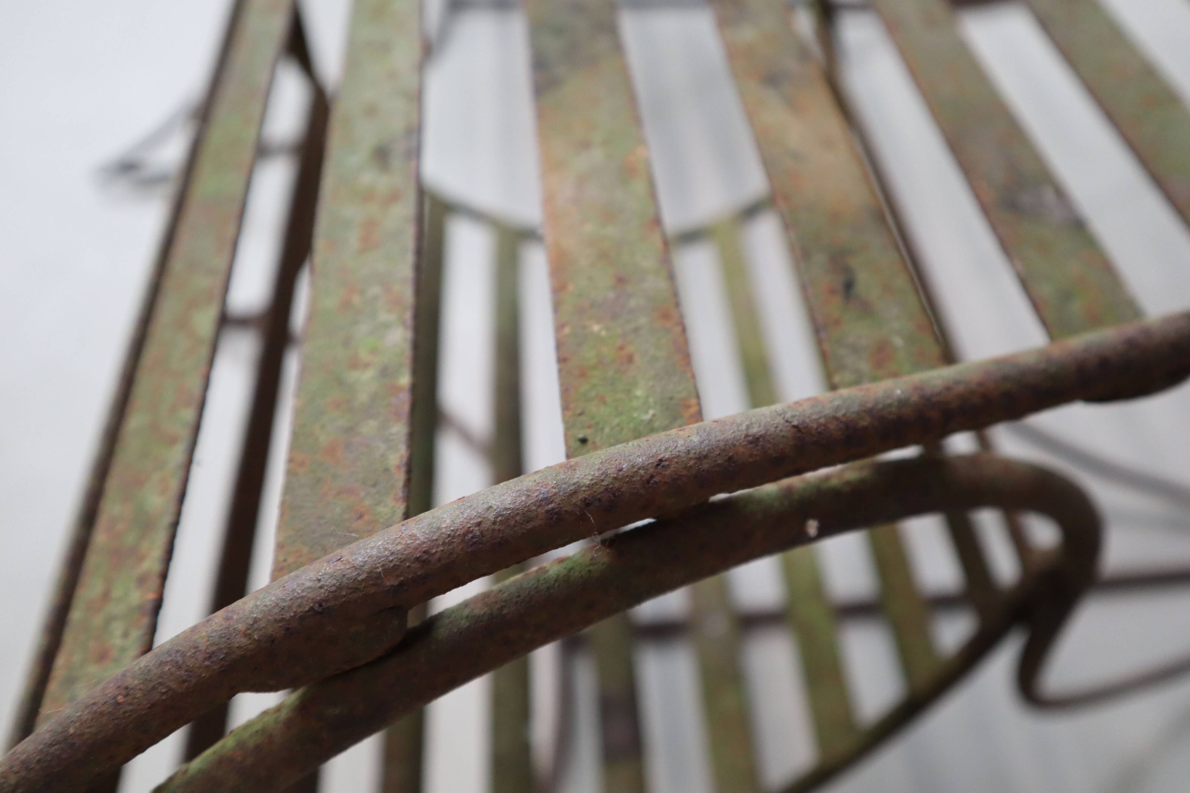 Set of three sculptural iron chairs