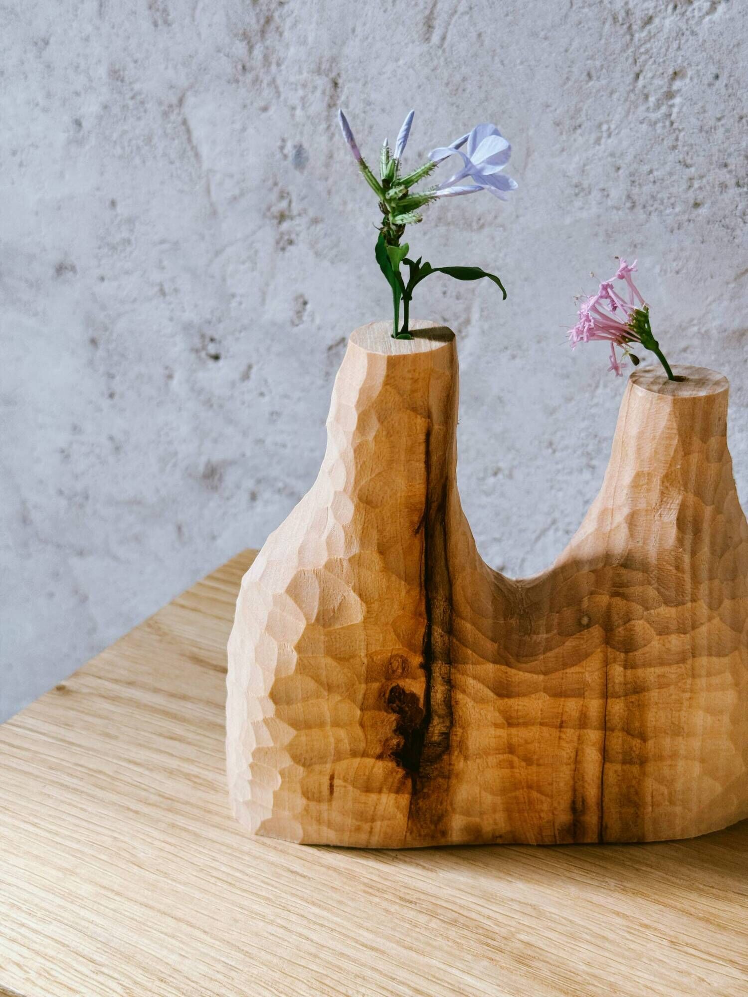 Hand-carved soliflore vase in solid lime wood.