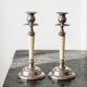 Pair of vintage candlestick holders in silver-plated metal with ivory-style plastic.