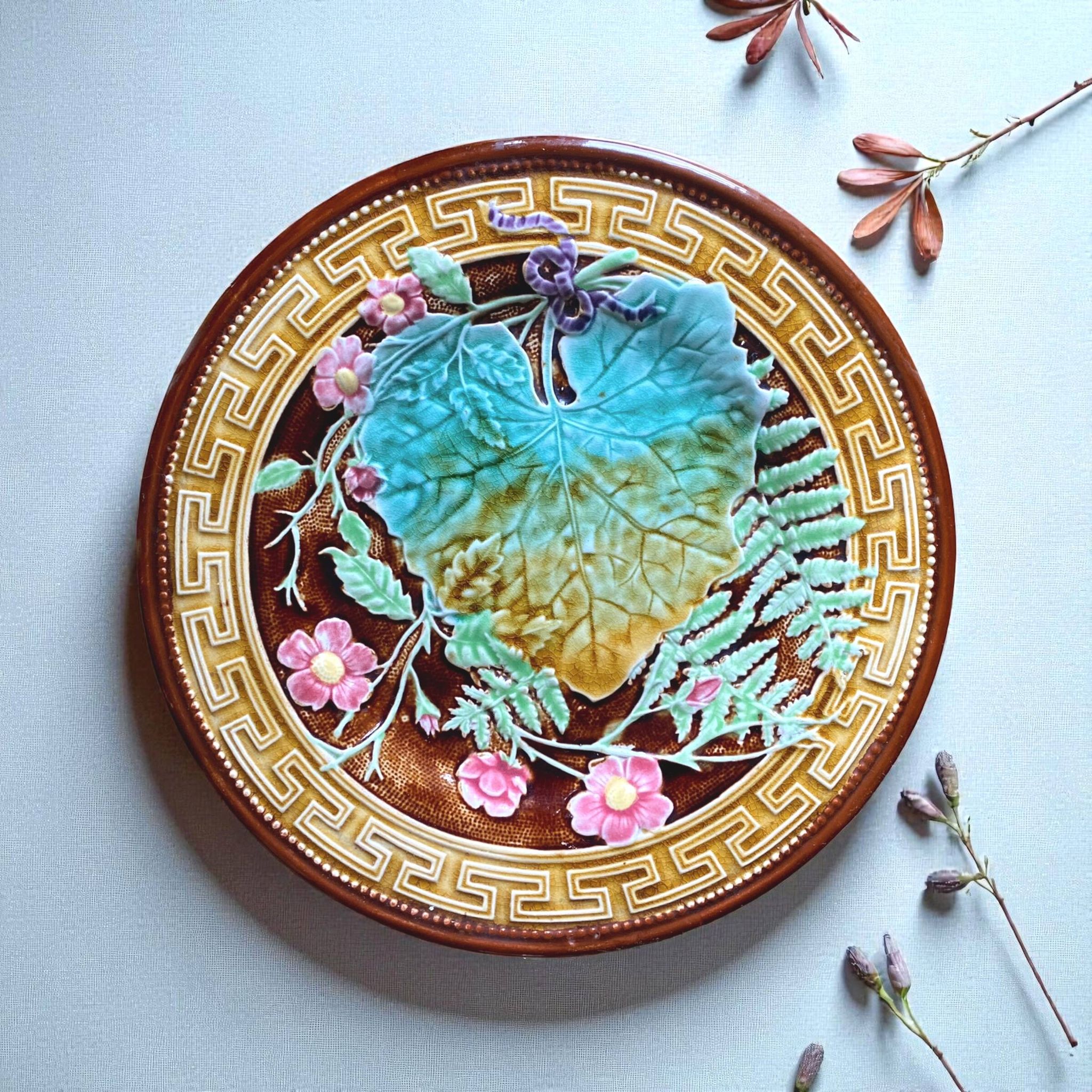 Antique plate from the Choisy Le Roi collection in slip with foliage and flowers