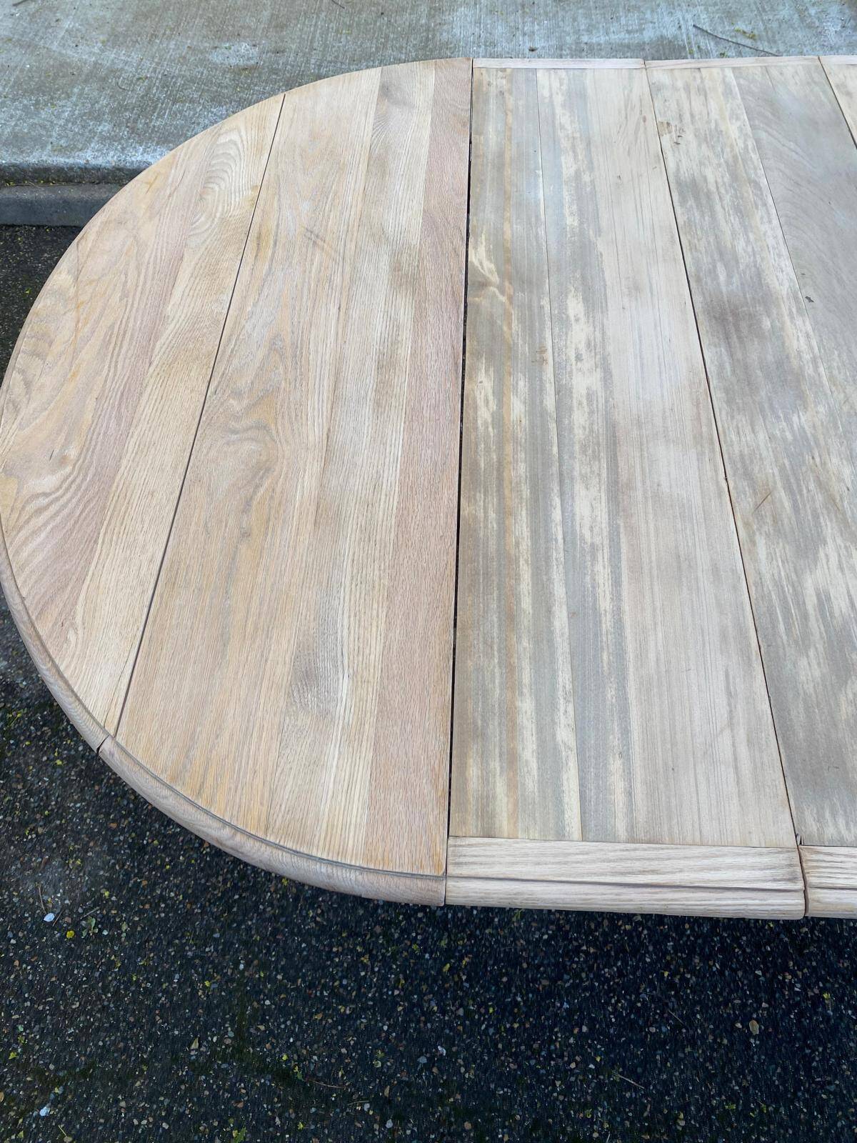 Renovated Louis Philippe round extendable dining table with 4 leaves.