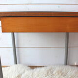 Green formica desk of water