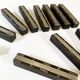 Set of 11 ebony wood knife rests with brass inlay
