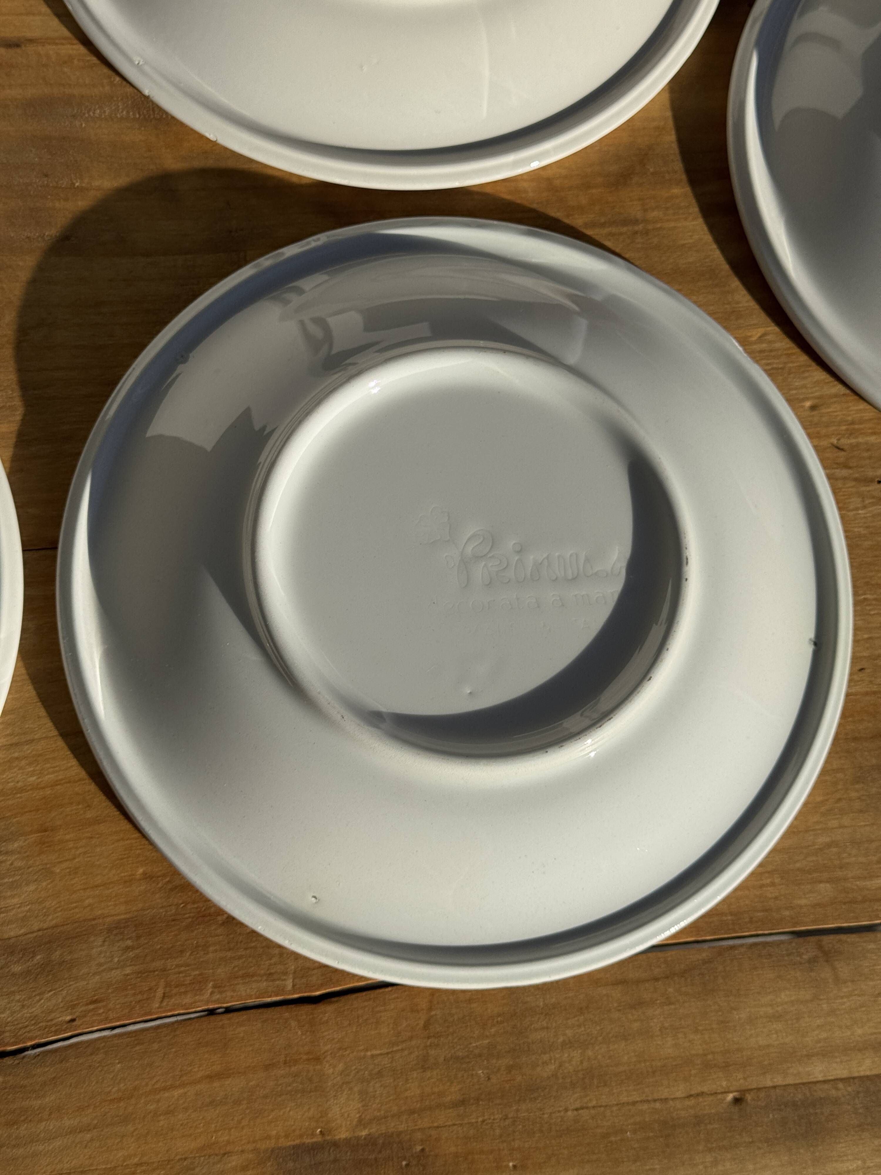 Set of 9 small Italian dessert plates Primula with red and green trim.