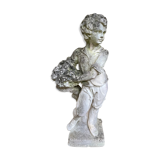 Stone garden statue to the child