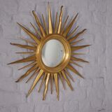 Sun mirror in gilded wood