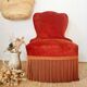 Red velvet toad armchair with fringes