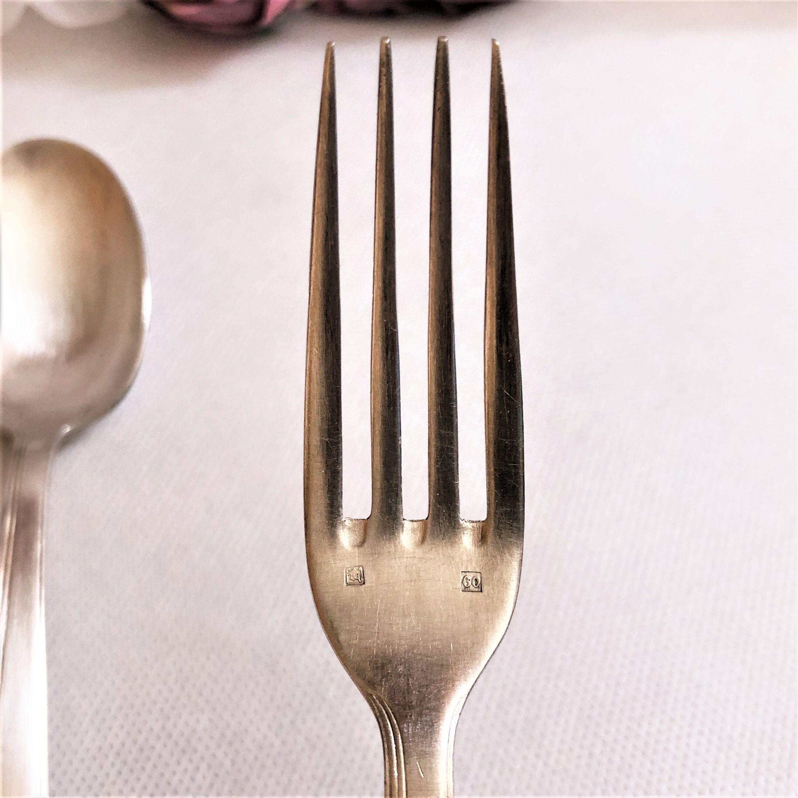 Set of 2 silver metal cutlery with punches