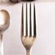 Set of 2 silver metal cutlery with punches