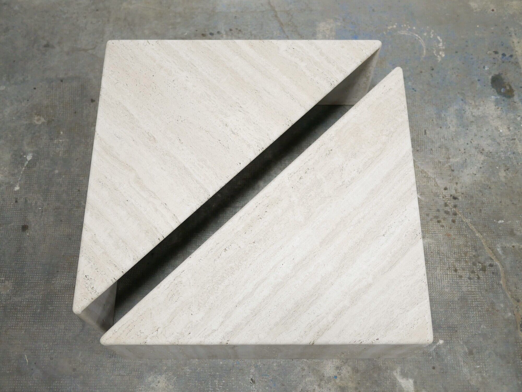 Series of 2 vintage travertine coffee tables published by Roche Bobois